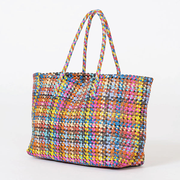 Multicolored woven handbag on a white background
