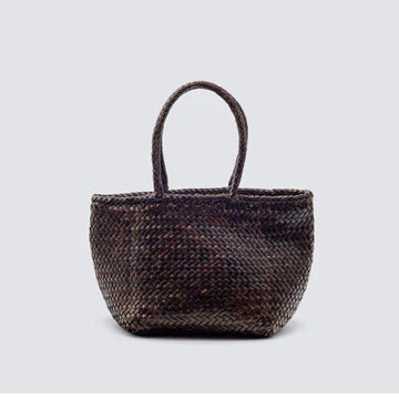 Woven brown handbag on a light gray background