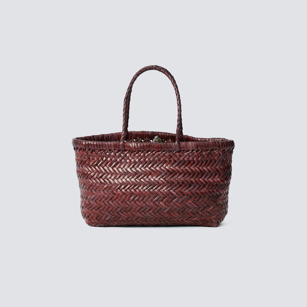 Woven handbag on a light gray background