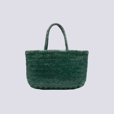 Green woven handbag on a white background
