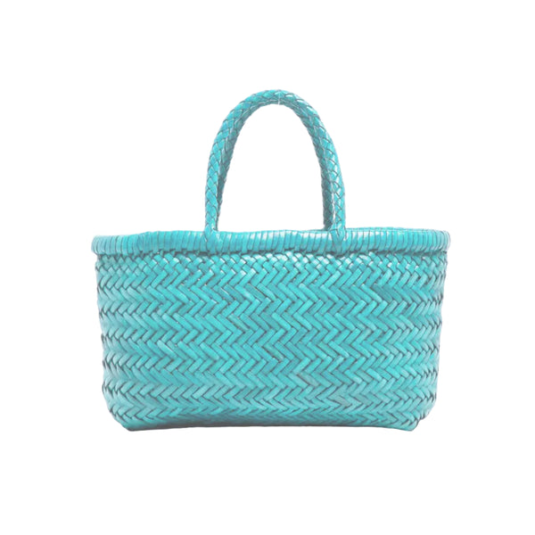 Turquoise woven handbag on a white background