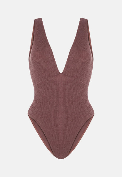 Grape swimsuit with a deep neckline on a light gray background