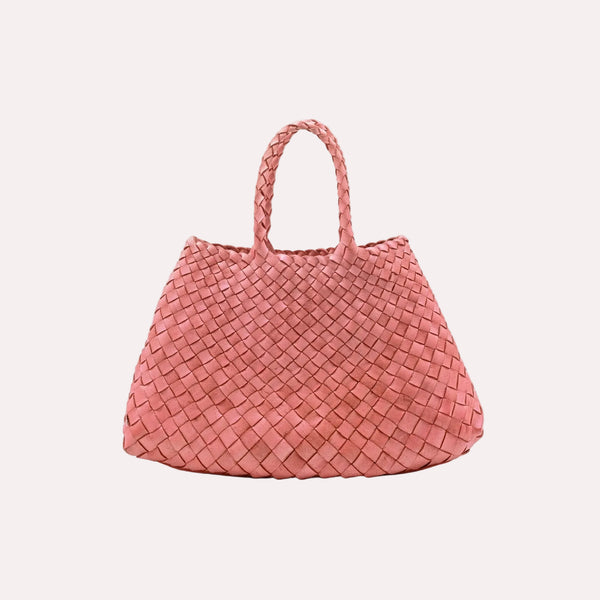 Pink woven handbag on a light gray background