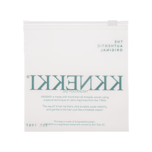 A white stand-up pouch of Kkenekki hair ties