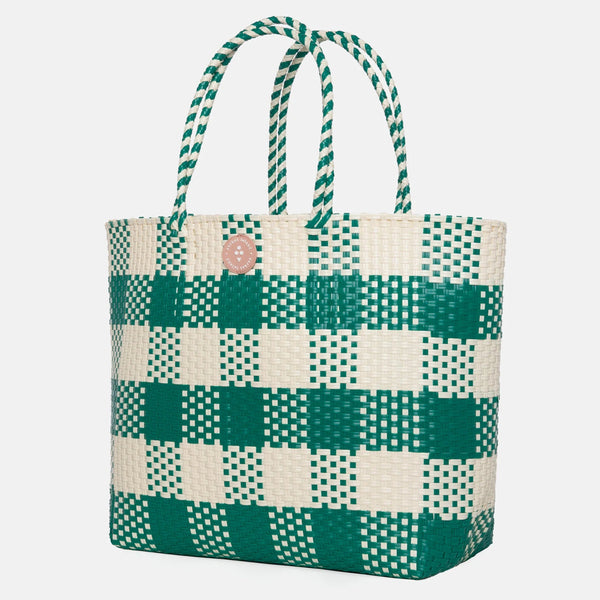 Green and white checkered tote bag on a light gray background