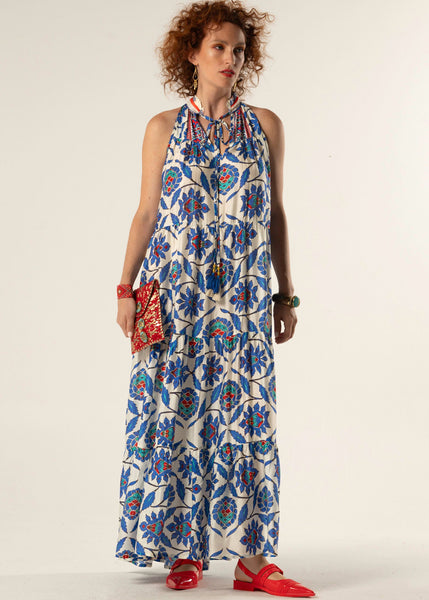 Woman wearing a floral dress with a plain background